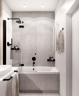 Aranżacja łazienki z szarymi dużymi płytkami  na ścianie i podłodze