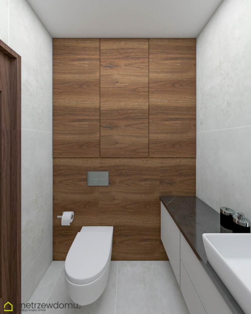 Łazienka z białą muszlą wiszącą i imitacją drewnianych płytek na ścianie