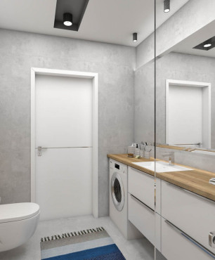Łazienka w klasycznym stylu z pralką i białą szafką wiszącą