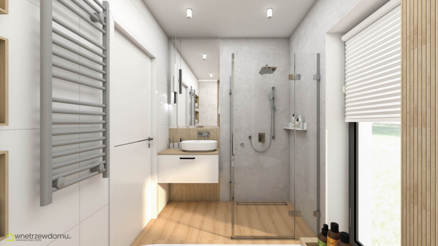Łazienka z prysznicem i szarym grzejnikiem zamontowanym na ścianie