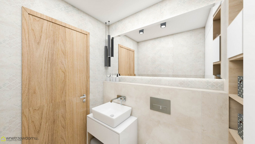Aranżacja łazienki z kremowymi płytkami na ścianie