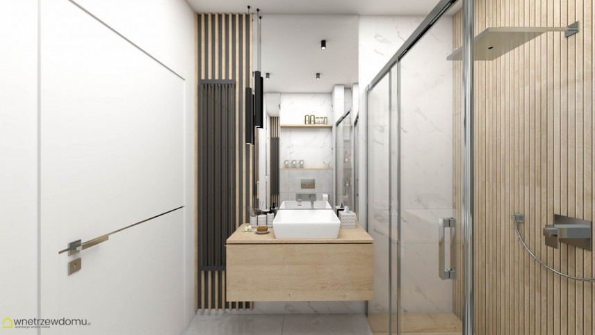 Łazienka z prysznicem i drewnianą jedną ścianą