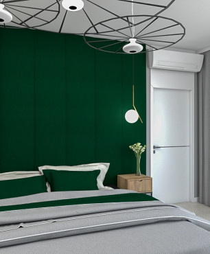Sypialnia z intensywną zielenią na ścianie oraz z drewnem