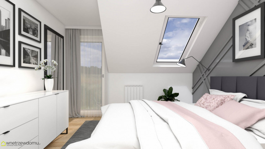 Sypialnia z oknem w suficie z białymi ścianami