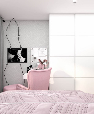 Sypialnia z białą szafą i różowym fotelem