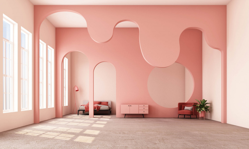 Salon z różowymi ścianami i półokrągłymi ozdobami na suficie