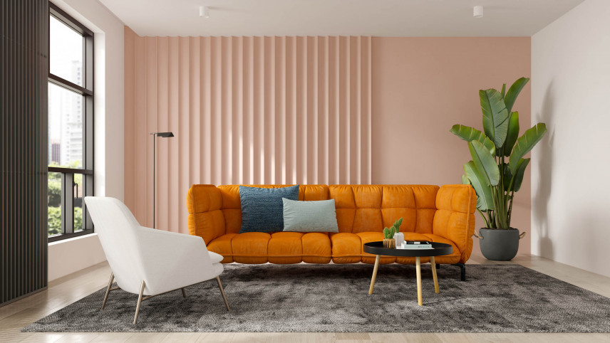 Salon ze stylową pomarańczową sofą