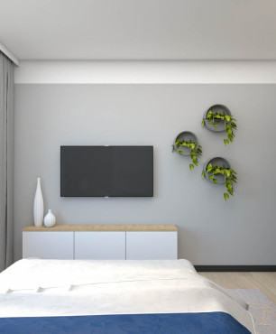 Sypialnia z telewizorem na ścianie