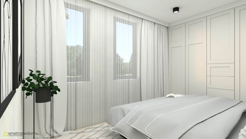 Sypialnia z białymi ścianami z modnym kwietnikiem