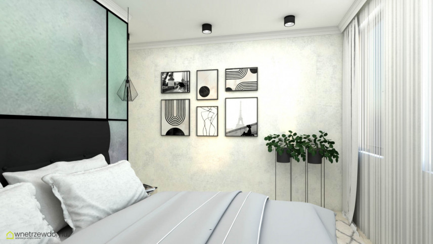 Designerska sypialnia z modnymi obrazami na ścianie