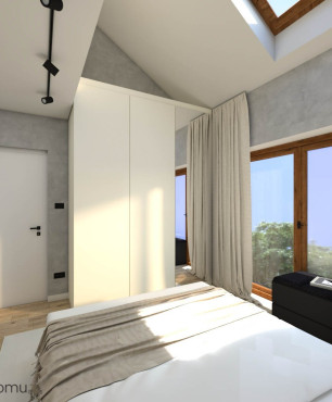 Sypialnia ze skosami na suficie oraz z oknem sufitowym