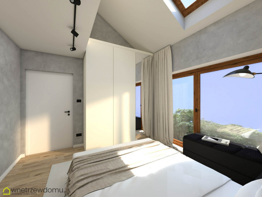 Sypialnia ze skosami na suficie oraz z oknem sufitowym