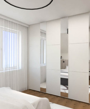 Sypialnia z dużą szafą z biało-lustrzanymi frontami