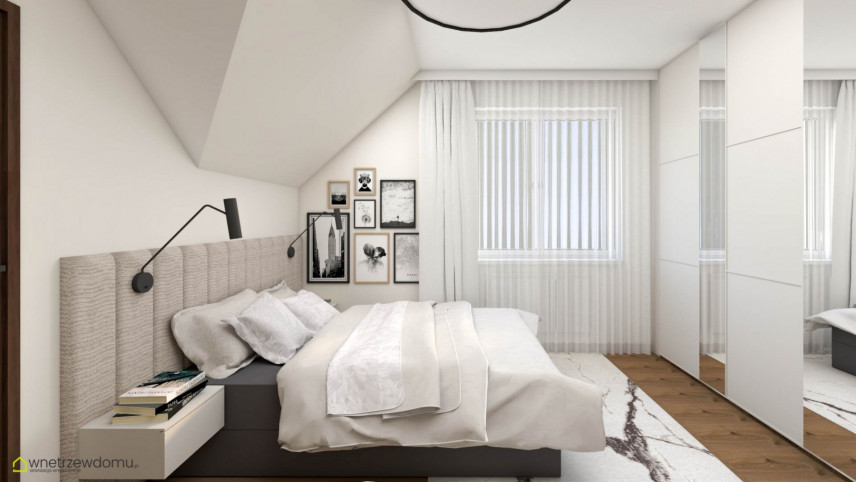 Sypialnia ze skosami sufitowymi z szafą z białymi frontami