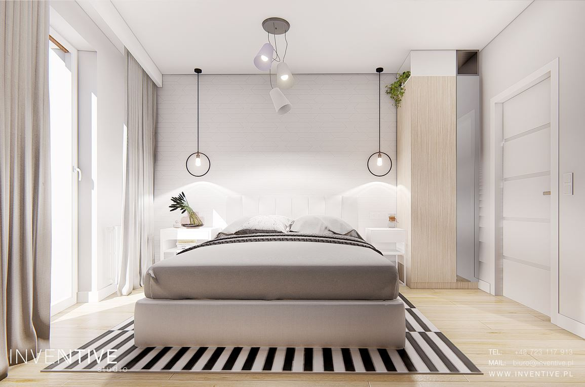 Sypialnia z łóżkiem kontynentalnym i dywanem w biało-czarne paski
