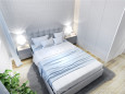 Nowoczesna sypialnia z łóżkiem kontynentalnym i białą trzydrzwiową szafą