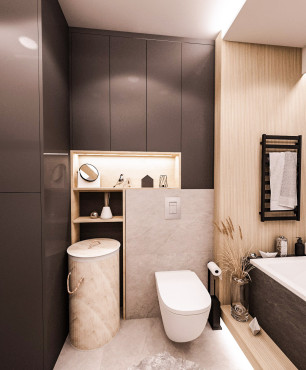 Nowoczesna łazienka z dużymi szarymi płytkami na ścianie