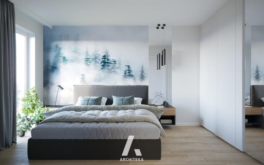 Sypialnia z tapetą z motywem lasu na ścianie