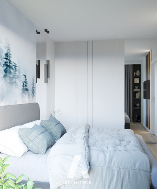 Sypialnia z szarym łóżkiem tapicerowanym oraz z tapetą na ścianie