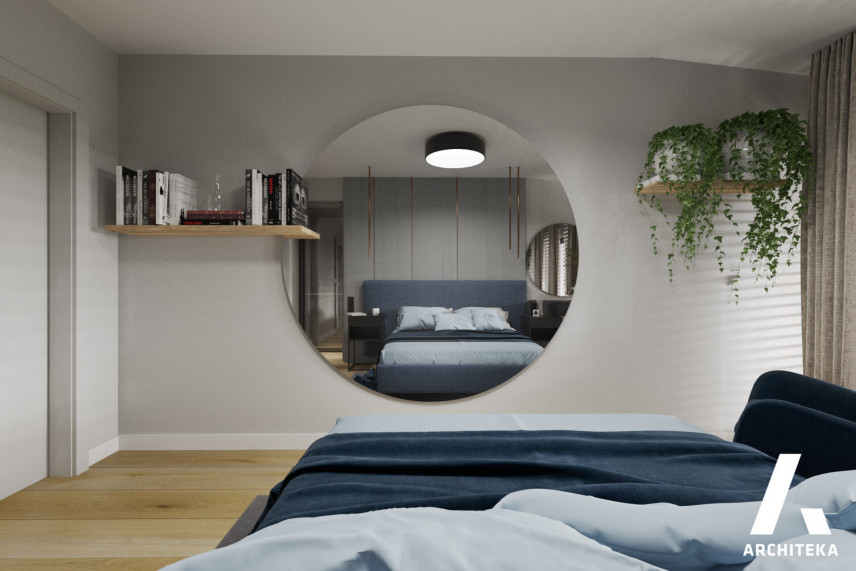 Sypialnia z dużym, okrągłym lustrem na ścianie