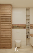 Łazienka z kremowymi płytkami na ścianie i podłodze