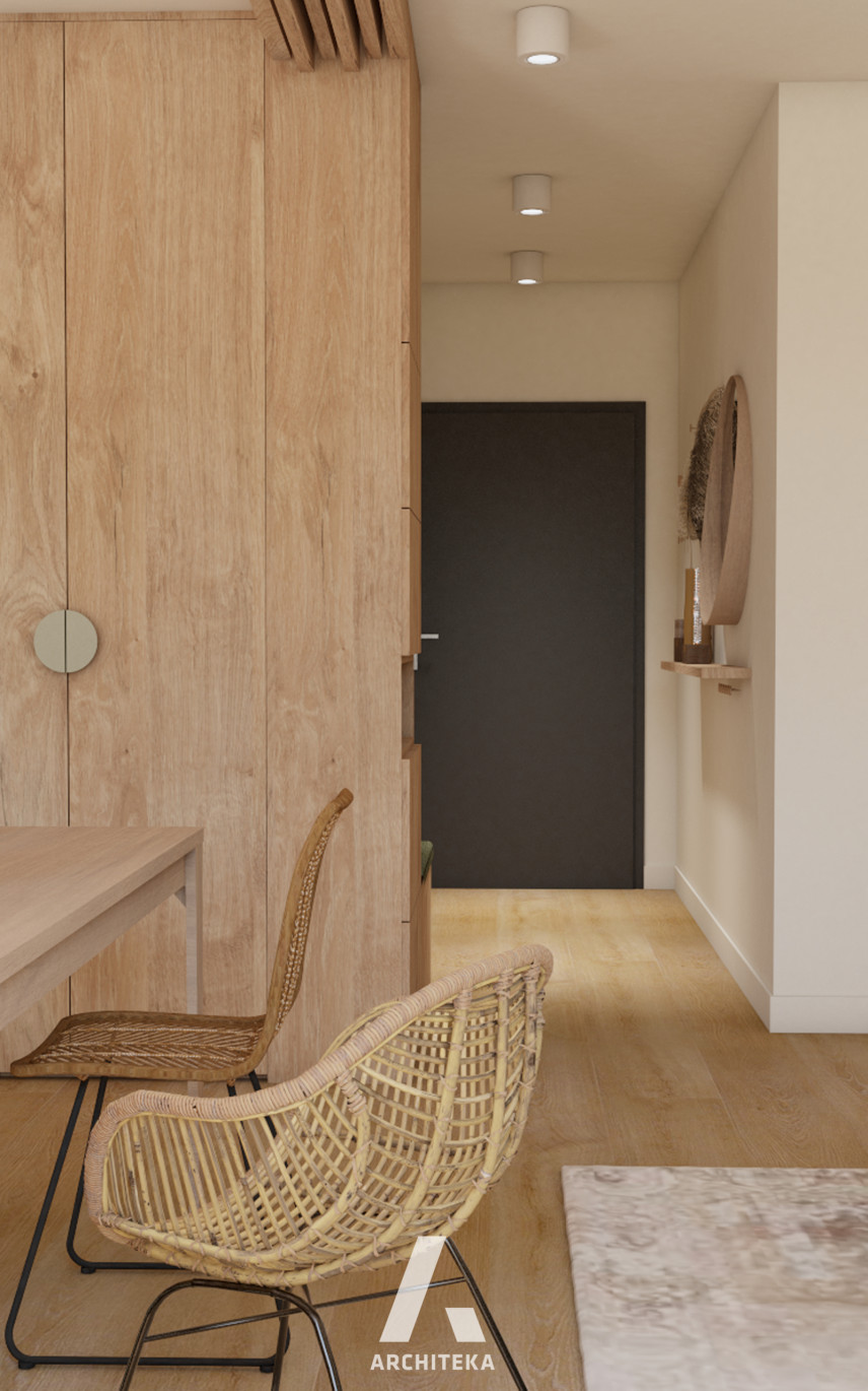 Wąski korytarz z szafą z drewnianym frontem