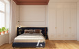 Minimalistyczna sypialnia w mieszkaniu w kamiennicy