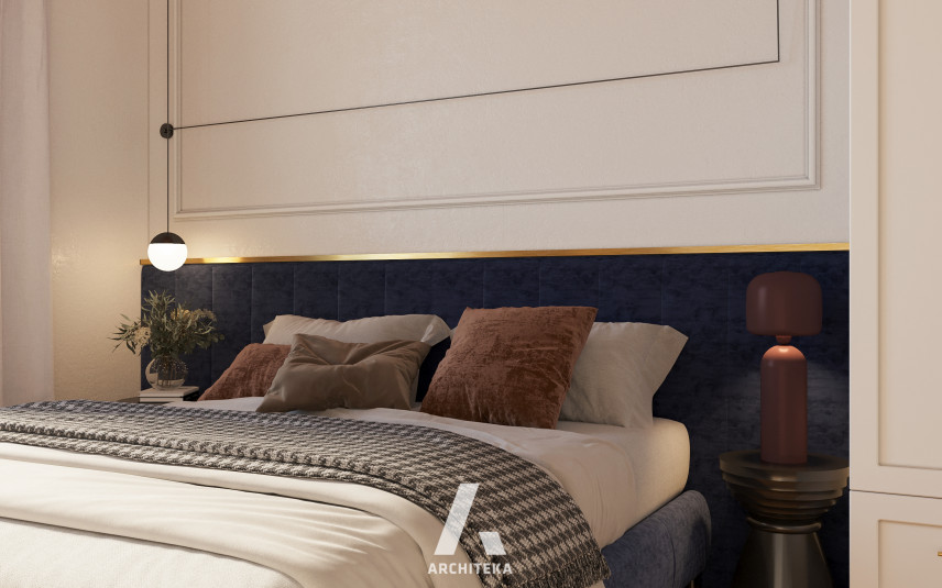 Granatowe, tapicerowane łóżko kontynentalne w sypialni