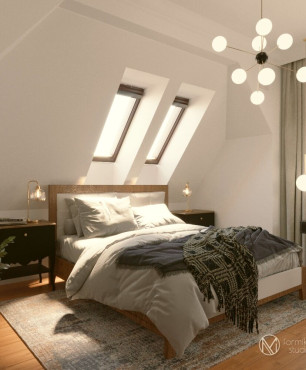 Sypialnia  na poddaszu z oknami sufitowymi