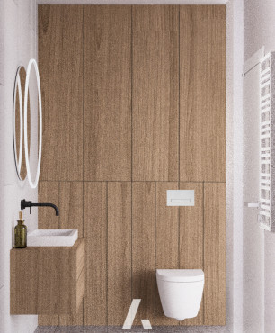 Łazienka z drewnianymi elementami oraz z okrągłym lustrem