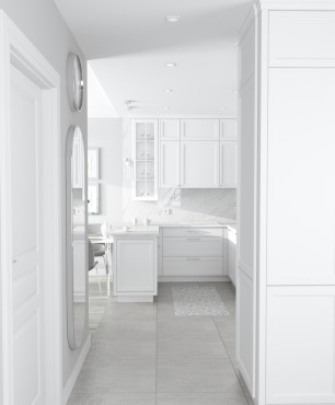 Mały, biały korytarz z biała szafą