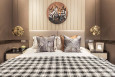 Klasyczna sypialnia z łóżkiem kontynentalnym oraz z tapicerowaną ścianą
