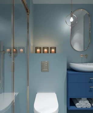 Łazienka w kolorze niebieskim z eliptycznym lustrem