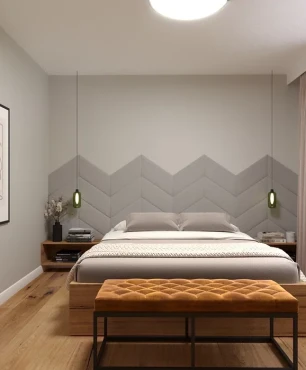 Projekt sypialni z łóżkiem kontynentalnym i szarym panelem tapicerowanym na ścianie