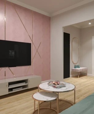 Salon z różową ścianą i telewizorem montowanym do ściany