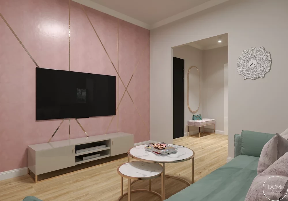 Salon z różową ścianą i telewizorem montowanym do ściany