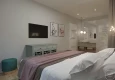 Klasyczna sypialnia z zieloną komodą i łóżkiem kontynentalnym