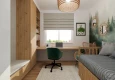 Projekt małego biura w mieszkaniu z tapetą z motywem lasu na ścianie