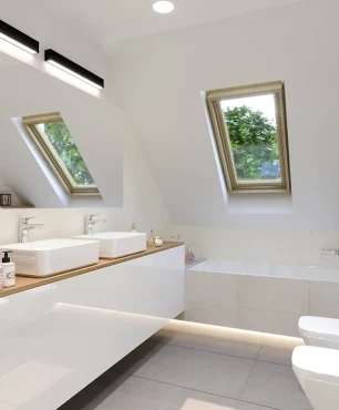 Łazienka na poddaszu z oknem sufitowym oraz bidetem i muszlą wiszącą