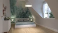 Projekt sypialni na poddaszu z tapetą na ścianie z motywem łąki