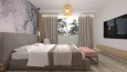 Projekt sypialni z kolorową tapetą na ścianie