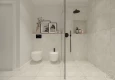 Łazienka z prysznicem walk-in, bidetem oraz muszlą wiszącą