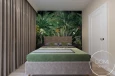 Projekt sypialni z łóżkiem kontynentalnym oraz z tapetą z motywem dżungli na ścianie