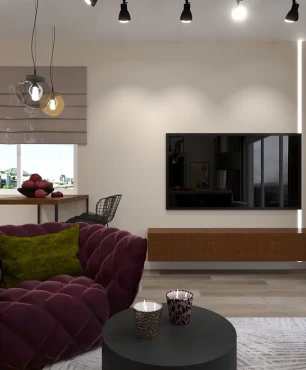 Salon z telewizorem montowanym do ściany oraz bordowym, fotelem pikowanym