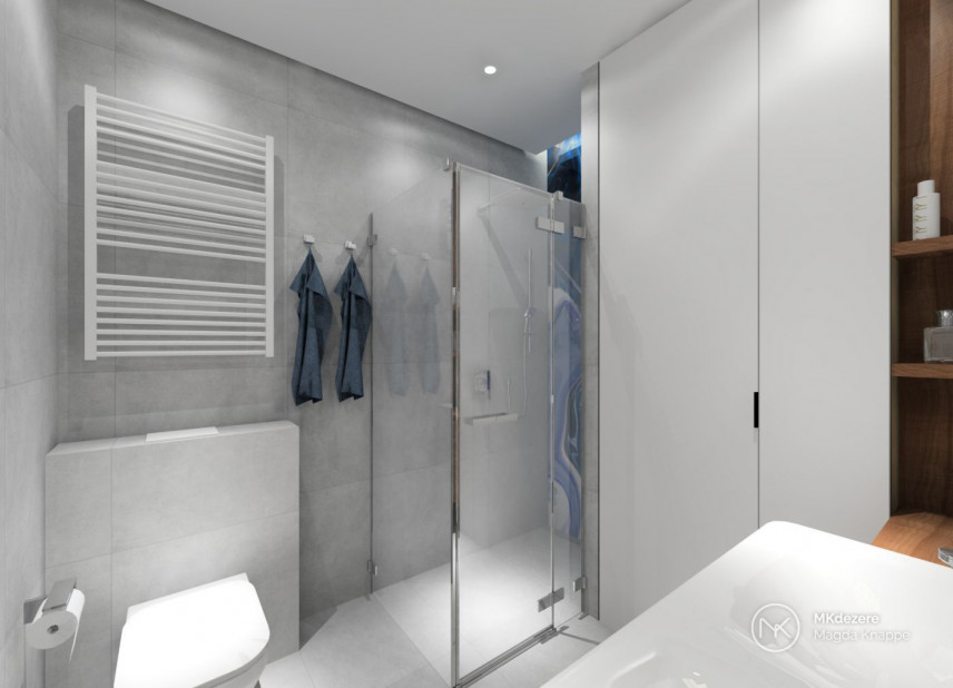 Łazienka z prysznicem z drzwiami odchylnymi i z białą szafą