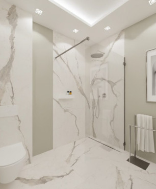 Projekt łazienki z białym gresem z szarym spiekiem kwarcowym oraz z prysznicem