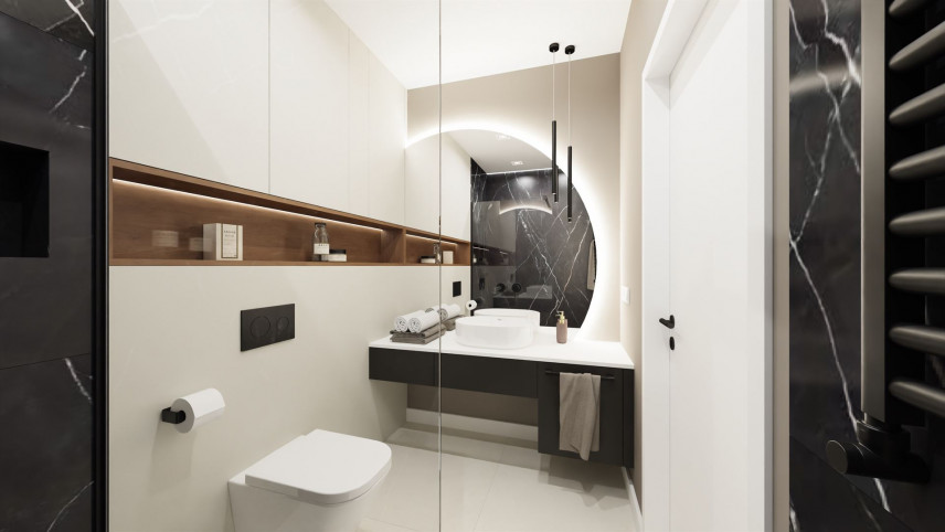 Łazienka z półką w ścianie oraz z półokrągłym lustrem