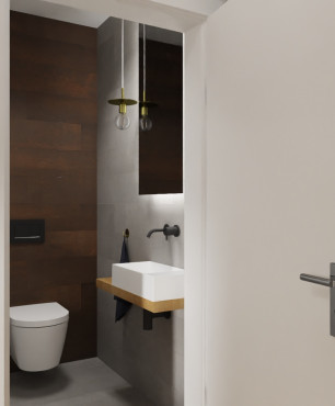 Mała toaleta z drewnianym blatem montowanym do ściany oraz białym zlewem nablatowym