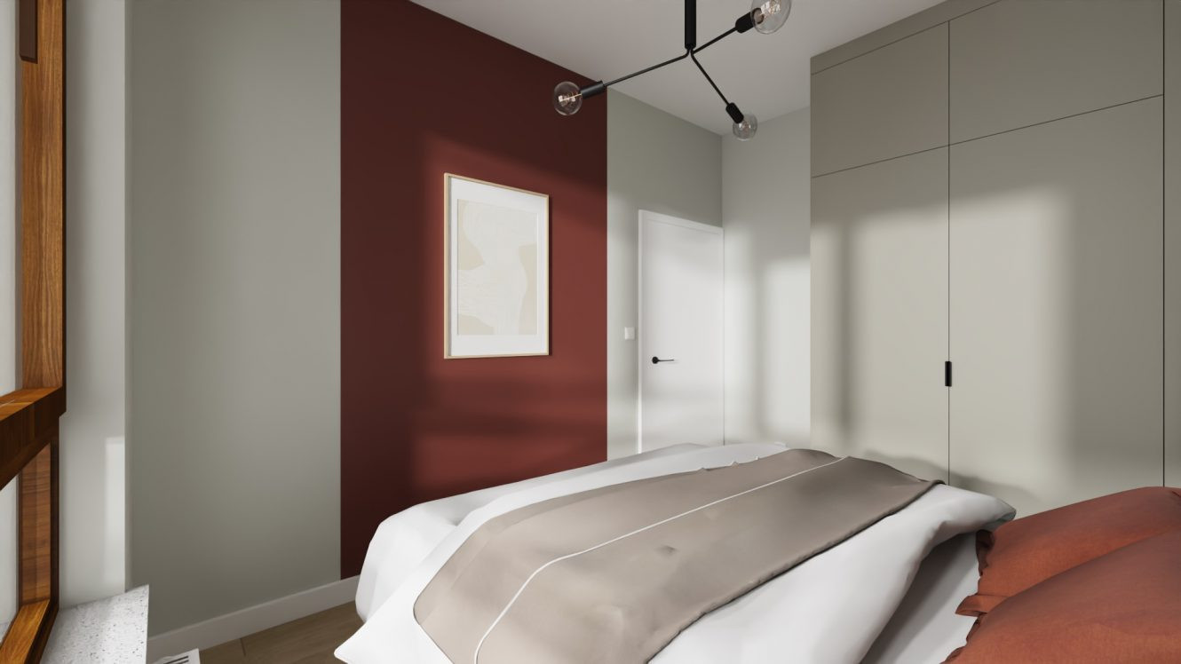 Projekt sypialni z bordową ścianą oraz szarą szafą w zabudowie