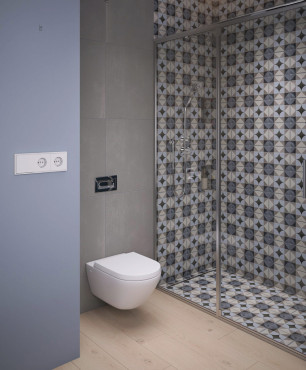 Łazienka z szaro-niebieską ścianą oraz z prysznicem z wzorzystym wzorem skandynawskim na płytkach